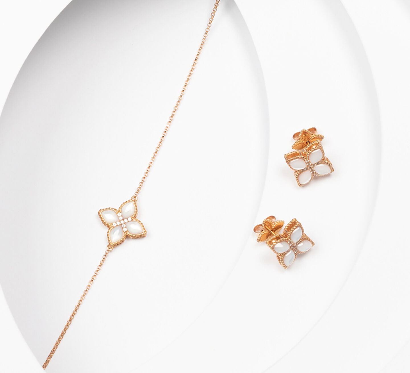 Gold Necklace and matching earrings with white flower shaped pendants